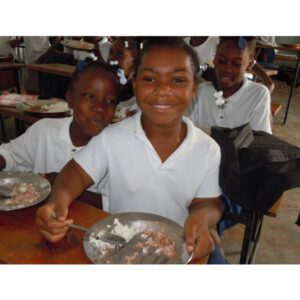 A picture of the school boys sitting and having lunch