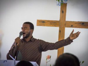 A picture of the man standing and praying