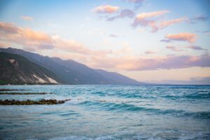 A long shot of the sea and the mountains