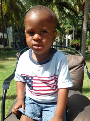 A picture of Ajun Belzince sitting on the chair