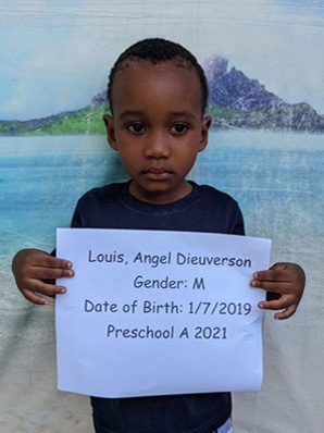A picture of Louis Angel Dieuverson holding the paper
