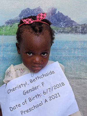 A picture of Bethchaida Cheristyl holding the paper