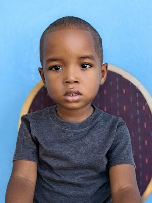 A picture of Saint Jeance Bethelson sitting on the chair